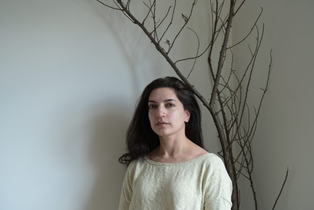 Picture of woman in front of a tree