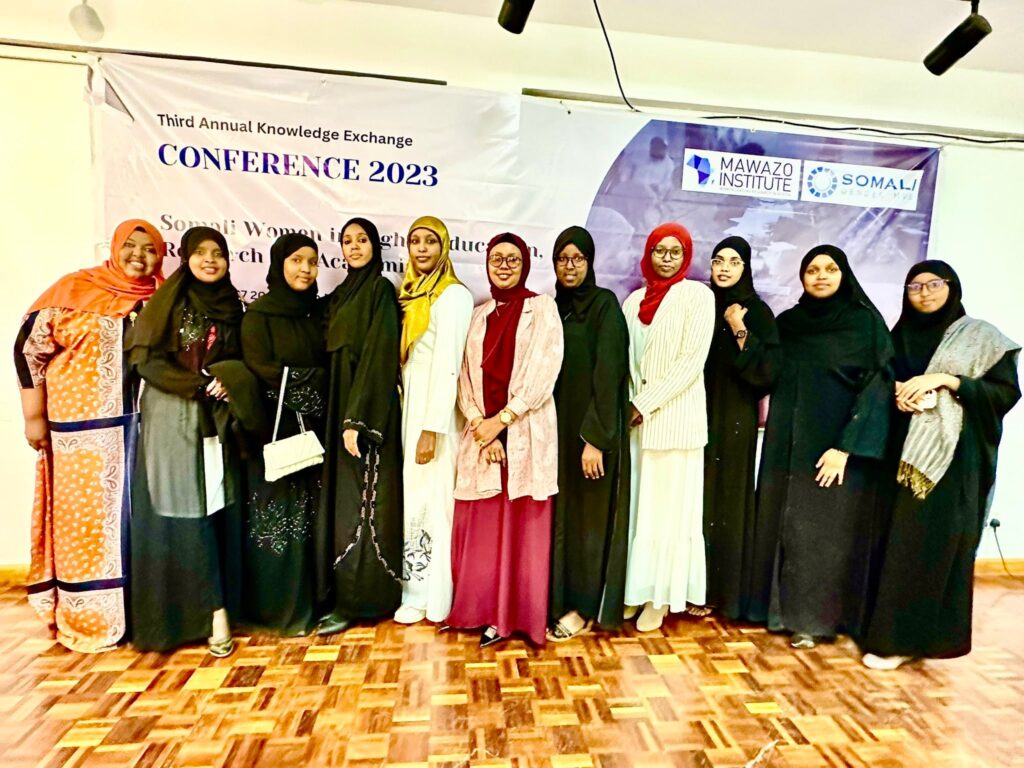 Group of Somali women pose together at the 2023 Knowledge Exchange Conference hosted by Somali Gender Hub and Mawazo Institute.