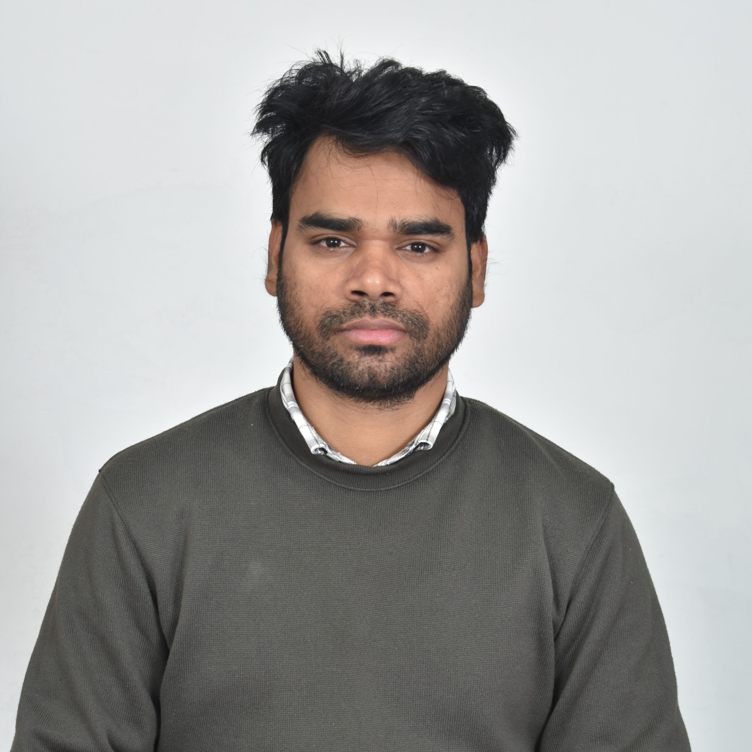 A man in a grey jumper