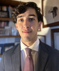A photo of a man in a suit